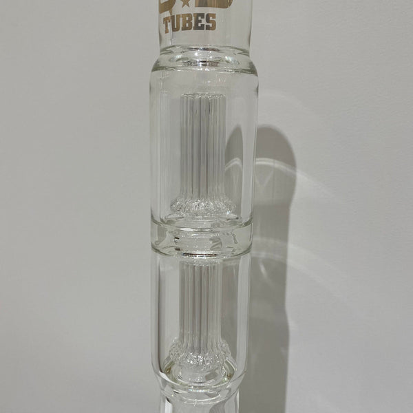 Made by US Tubes

Made in Berkeley, CA

Features Double Circ Perc made with profile tubing

Features 50 x 7mm beaker bottom water pipe

Features 24mm joint

Features removable 24/19mm showerhead downstem

Comes with matching 19mm slide

Features US Tubes decal (decal may vary)

Approximately 19 inches at tallest point

Approximately 6 inches at widest point


